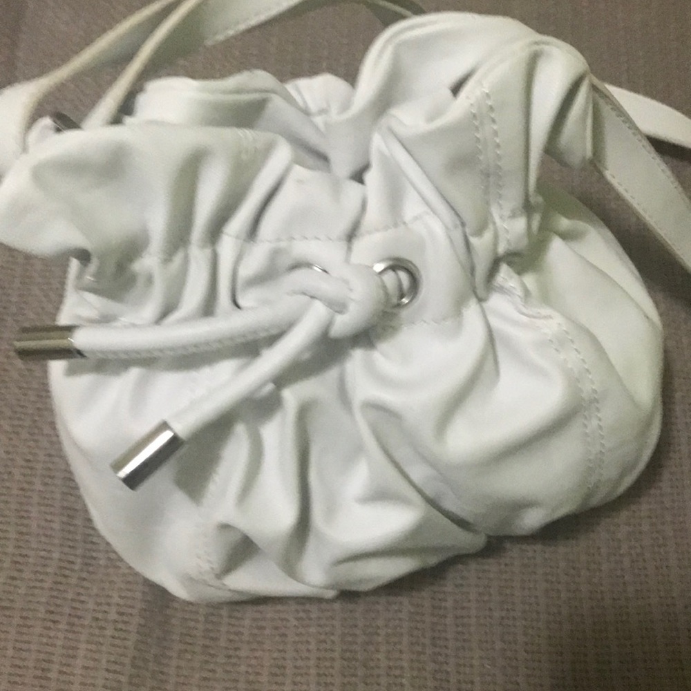 Cute little white draw tie bag! Maybe used once.